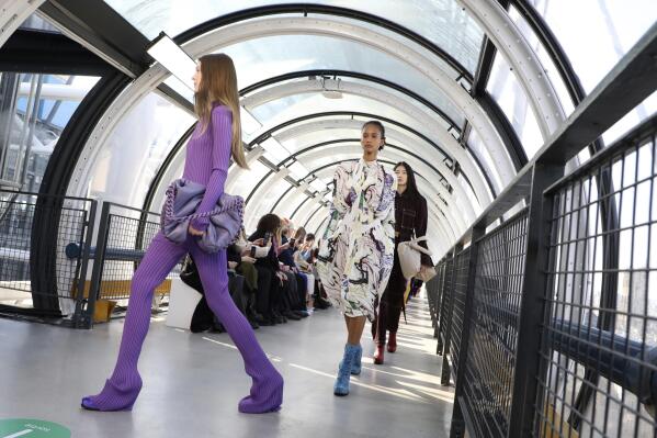 Paris fashion houses showcase designs inside top art museums | AP News